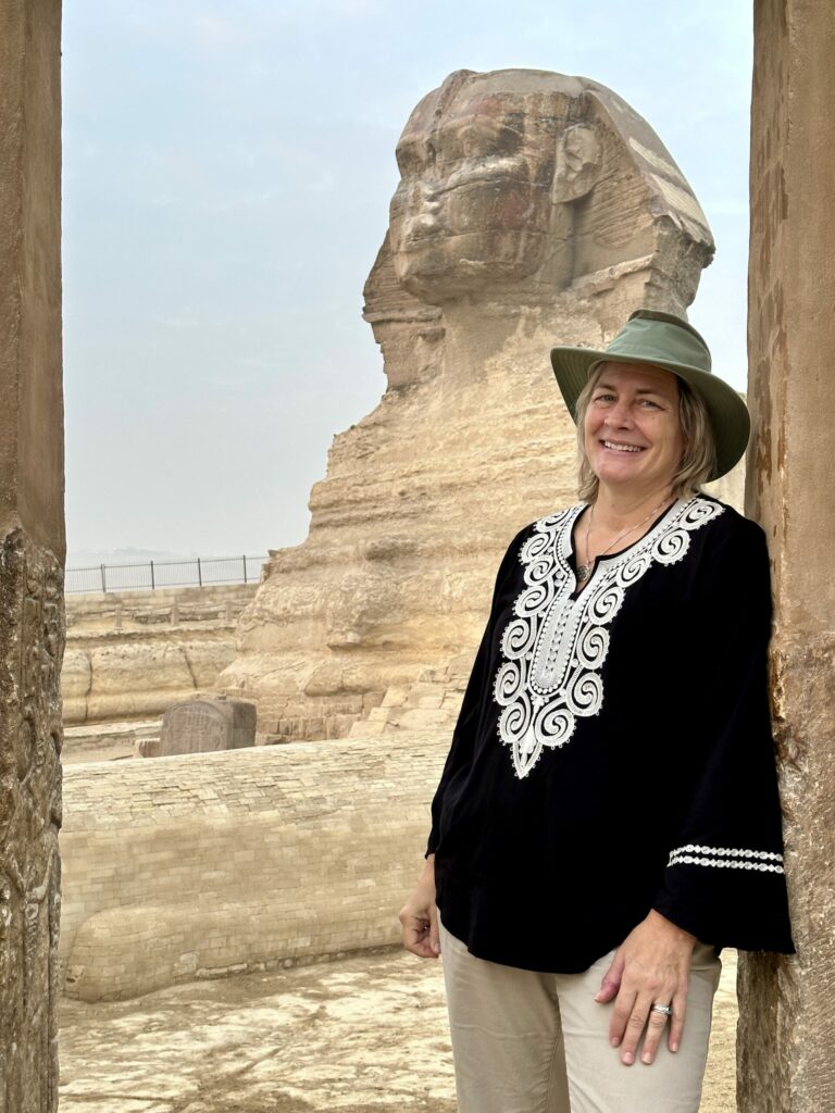 Rev Karen Fry in Egypt with the Sphinx in the distance