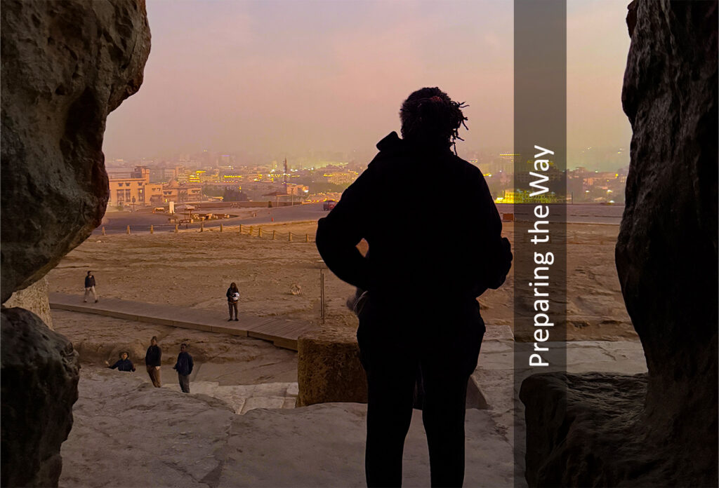 Spirit Tours traveler looking out from the Great Pyramid of Giza at dawn during an Egypt journey